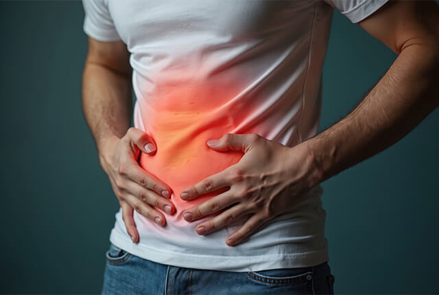 胃腸の不調をきたしている男性